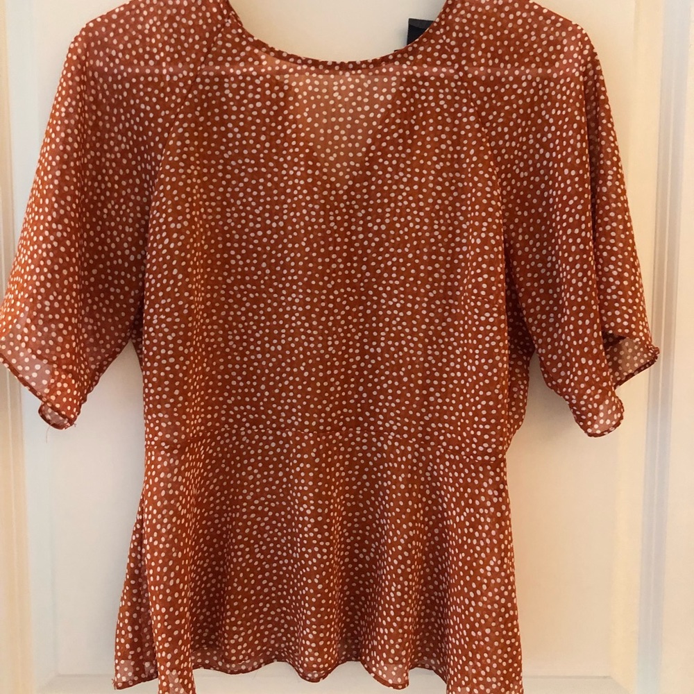 Anthropologie polka dot peplum top